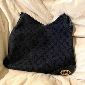 Black Gucci handbag with shoulder strap